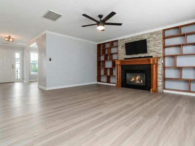 Empty, spacious room with natural light, ready for a workout.